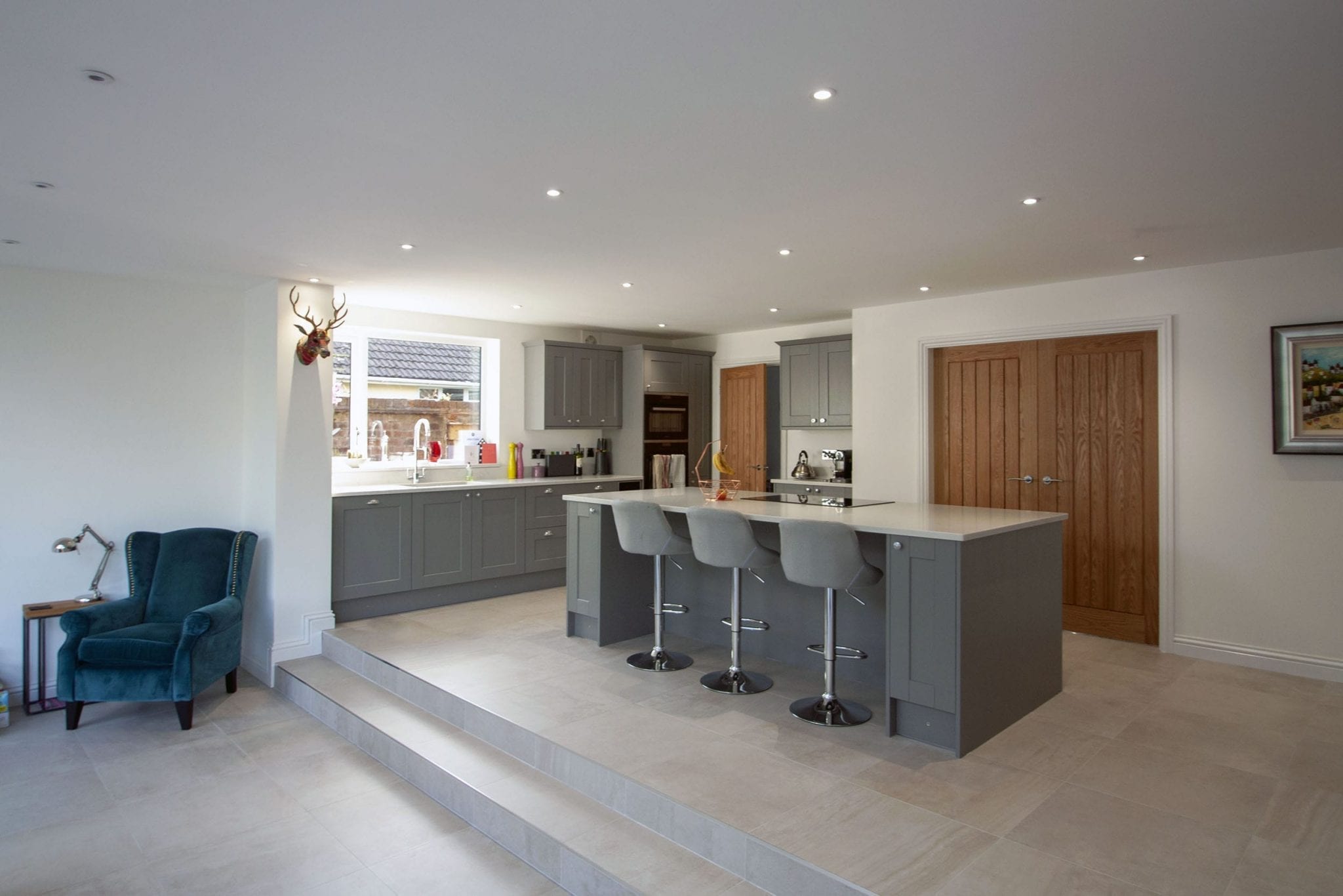 modern open plan kitchen with grey island unit